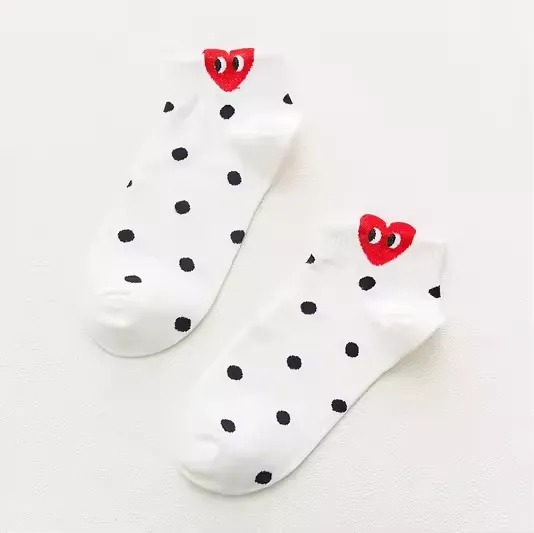 CDG Play Dot White Black Socks Front CDG Play Dot White Black Socks front view with heart logo