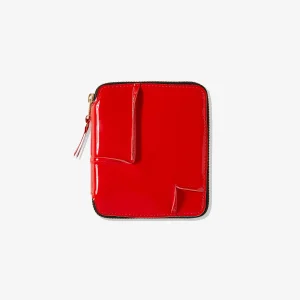 CDG Reversed Hem Full Zip Around Wallet Red