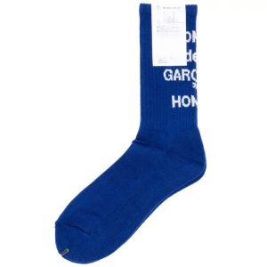 Front view of Comme Des Garçon Homme logo socks in blue